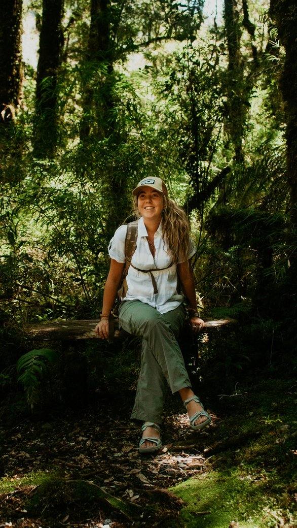 Pepa, founder of Do Local Travel, on a forest trail in the Chilean Andes